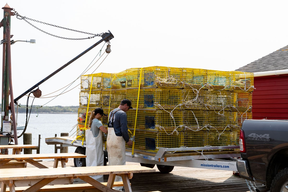 Mission Open Light Duty Deckover Trailer At Dock With Two Lobstermen